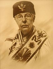 Photograph (sepia tint) of Annie Besant in masonic gown, hat and sash