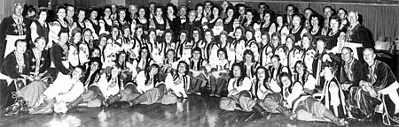 Ukrainian choir "Boyan" -- director Vasyl Matiash (top row -- centre), with the "Ukrainian Folk Ballet" -- musical director and choreographer -- Natalia Tyrawsky (top row -- centre). Photo early 1970s, Sydney Boyan and Tyravska.jpg