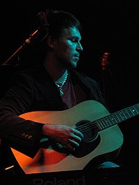 BT playing an acoustic version of "Satellite" from his 1999 album, Movement in Still Life, in 2006 Brian Transeau.jpg