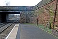 The station bridge and a commemorative stone dated 1872.