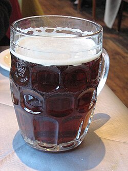 British dimpled glass pint jug with ale.jpg