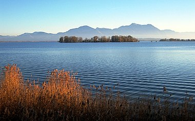 Krautinsel with (right) a small part of the Herreninsel island and in the background the Chiemgau Alps