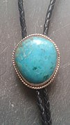 Chrysocolla and silver bolo tie. This chrysocolla specimen is from the Kennecot Copper Mine in Bingham Canyon, West Valley City, Utah.