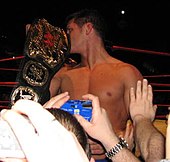 Rhodes captured his first championship in WWE in December 2007: the World Tag Team Championship, with partner Hardcore Holly Cody Rhodes World Tag Team Champ.jpg