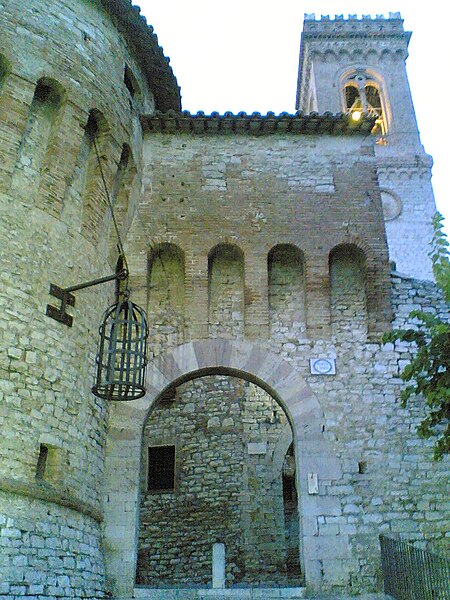 Hanging cage at the main gate to Corciano, Province of Perugia, Italy