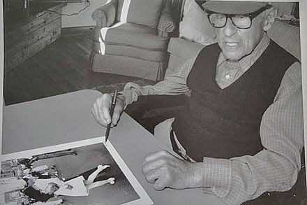Eisenstaedt signing a "V-J Day in Times Square" print on August 23, 1995 at his Menemsha cabin on Martha's Vineyard