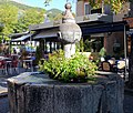 Fontaine place Saint-Marcellin, rue Clovis-Hugues (édifice répertorié dans la base Mérimée du Ministère de la culture français).