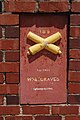A plaque adorns the side of the entrance featuring two crossed cannons, and reads "Colonel William A. Graves, Commanding."