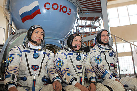 Expedition 36 backup crew members in front of the Soyuz TMA spacecraft mock-up in Star City, Russia.jpg