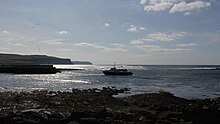 Ferry approchant de la jetée de Doolin