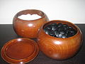 Go stones in traditional bowls