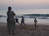 K33. A Goan mother watching a soccer game at Agonda beach, Goa.