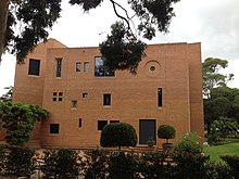 The exterior of the Haileybury Chapel showing the external three storey Ante-chapel wall and Bell Tower to the left. Haileybury Chapel, Melbourne Ante-chapel wall external.jpg