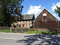 Residential stable house and two side buildings of a three-sided courtyard