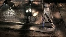 Under a glass floor, the original archeological dig is reproduced with actual timbers Jorvik underfloor 05 May 2107.jpg