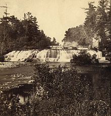 The historic Junction Falls of the yet-undammed Kinnickinnic River in River Falls, Wisconsin. Photograph taken by John Carbutt between 1864 and 1865 and published as a stereoview in a set of scenery pictures of "The Upper Mississippi, Minnesota and the Vicinity". Junction Falls, Kinnickinnic River, River Falls, Wisconsins.jpg