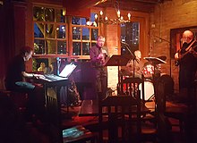 Richard Terrill (center) playing saxophone with the Larry McDonough Quartet in 2018