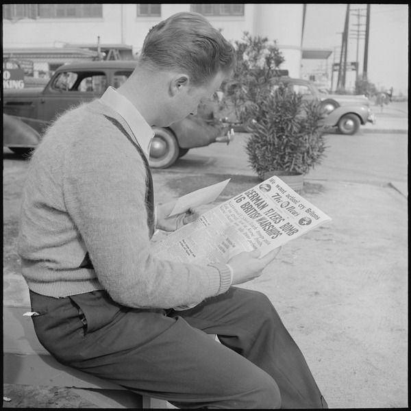 File:Los Angeles, California. Lockheed Employment. Cause and Effect. This young man reading the war news holds an... - NARA - 532213.tif