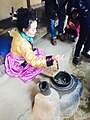 Making silk from cocoon at Korean Folk Village.jpg