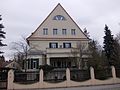 Residential house in open development with fencing