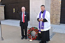 The rededication of the North London Railway War Memorial in 2011, attended by TfL's Peter Hendy and the Revd James Westcott of St Chad's Church. NLR War Memorial rededication Hendy Westcott.jpg