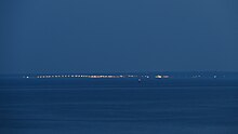 The lights of Oak Bluffs at twilight viewed from Mashpee (about 9 miles/14.5 km distant) Oak Bluffs View.jpg