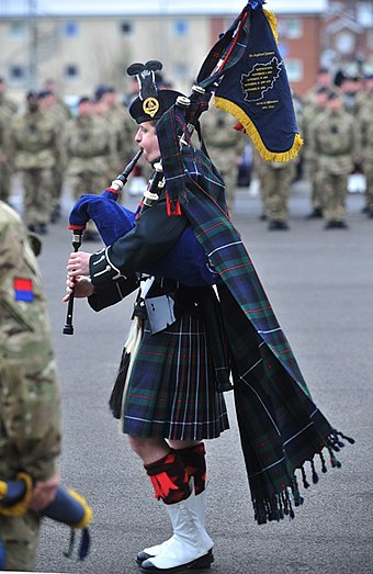 A piper of The Scottish Gunners at the parade commemorating its renaming in 2012