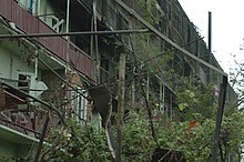 An apartment building in Gori, damaged during the war Ruins of a burnt apartment building in Gori.jpg