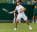 Ryan Harrison competing in the first round of the 2015 Wimbledon Qualifying Tournament at the Bank of England Sports Grounds in Roehampton, England. The winners of three rounds of competition qualify for the main draw of Wimbledon the following week.
