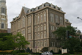 The main building of St. Ignatius College Prep in Chicago, Illinois, designed by Canadian architect Toussaint Menard, is a classic example of the style. It is one of the five extant, public buildings in Chicago that predate the Great Fire of 1871.