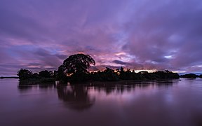 Silhouette of an island at dusk with purple sky and clouds in Don Det Si Phan Don Laos.jpg