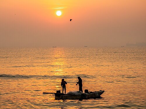 Fishermen working in scrotching heat of summer