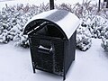 Snow-covered trash can at Renaissance Suites at Flatiron