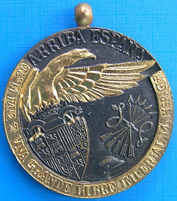 Medal commemorating the Nationalist victory of the Civil War, imprinted with the slogan Arriba Espana. Spanish Civil War Medal (Francoist).jpg