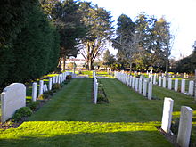 German (right) and Commonwealth pilot graves, St Andrew's Church. The large tombstone is a memorial to pilots lost at sea. St Andrew's Tangmere 5.JPG