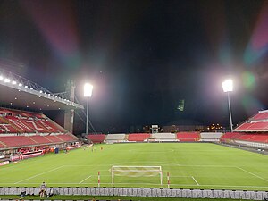 The Brianteo stadium during the nightime, with the grandstand on the left