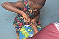Street esthetician providing toenails care.jpg
