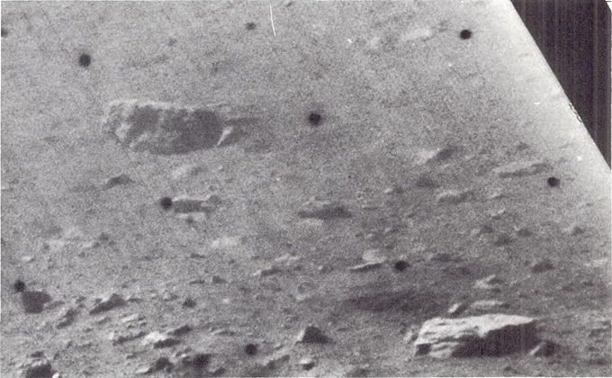 Blocky fragments on north wall of crater in which the spacecraft is located