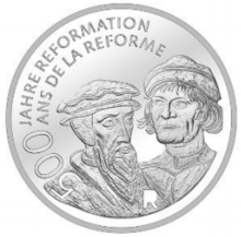 Zwingli (right) and John Calvin on a Swiss 20 franc coin commemorating the 500th anniversary of the Reformation, 2017. (Source: Wikimedia)