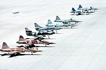 Top Gun F-5E and F-5F Tiger II fighters alongside A-4M Skyhawk attackers, all painted in aggressor markings, at NAS Fallon in 1993 TopGun fighters at NAS Fallon in 1993.JPEG