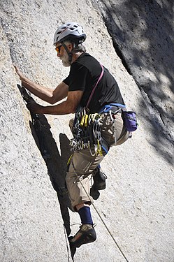 Climber climbing Guide Cracks on Daff Dome, Tuolumne Meadows