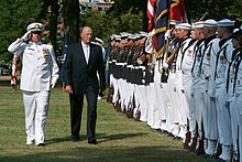 US Navy 050919-N-2383B-047 His Majesty King Harald V of Norway is escorted by Commanding Officer, U.S. Navy Ceremonial Guard, Cmdr. Scott Chapman, during a full honor ceremony.jpg