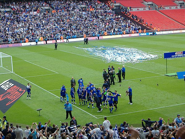 Millwall players celebrating promotion to the Football League Championship at Wembley Stadium in 2010.