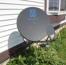 A WildBlue satellite dish on the side of a house for receiving Internet WildBlueDish.jpg