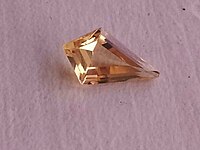 Yellow topaz in stepped kite-shaped cut