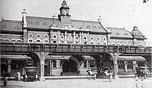 The second station, built in 1915, behind an elevated freight line