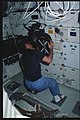 41C-03-103 - STS-41C - Astronaut Hart changes film in the IMAX camera - DPLA - 9561ade7e05488dbe0354020c8c62c08.jpg