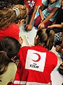 A Turkish Red Crescent staff conducting activities for children