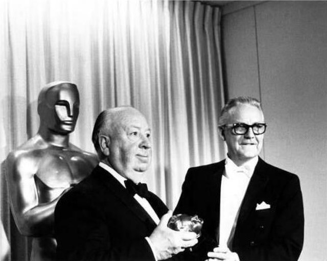 Alfred Hitchcock receiving the Irving G. Thalberg Memorial Award from Robert Wise (40th Academy Awards, 1967)