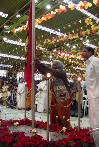 A mother of a dead LTTE cadre raises the Tamil Eelam flag on Maaveerar Naal 2002 in Germany